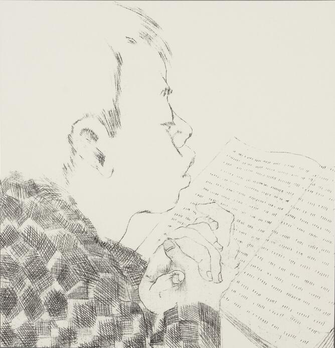 A black and white print of a young boy in a patterned shirt reading with hands folded over a book