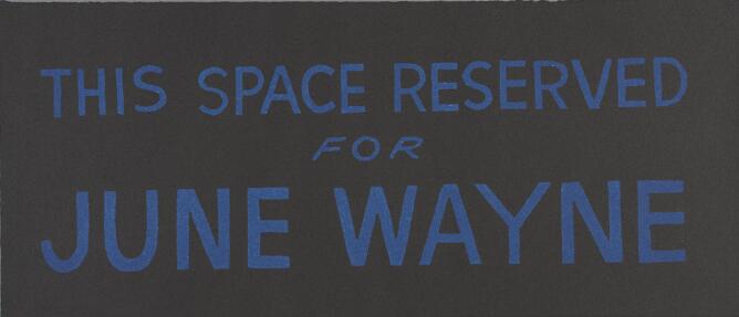 A print of large blue text against a black background that reads This Space Reserved for June Wayne