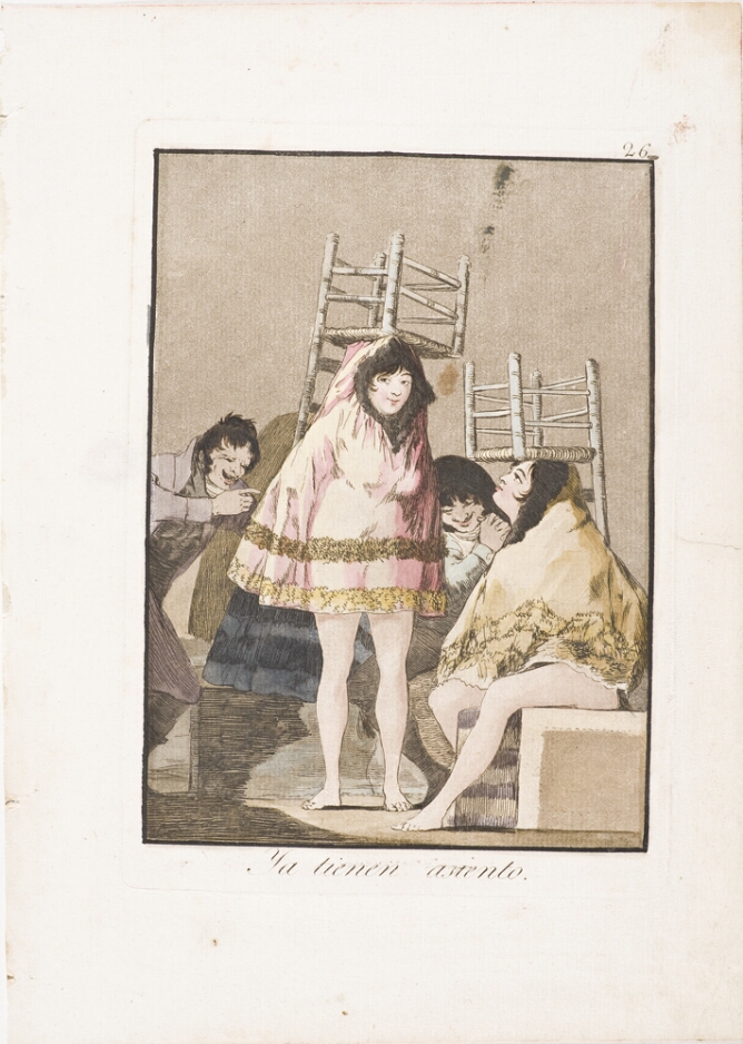 A color print of two women, one standing and the other sitting, with upturned chairs on their heads, garments over their heads with legs exposed, while two men laugh at them