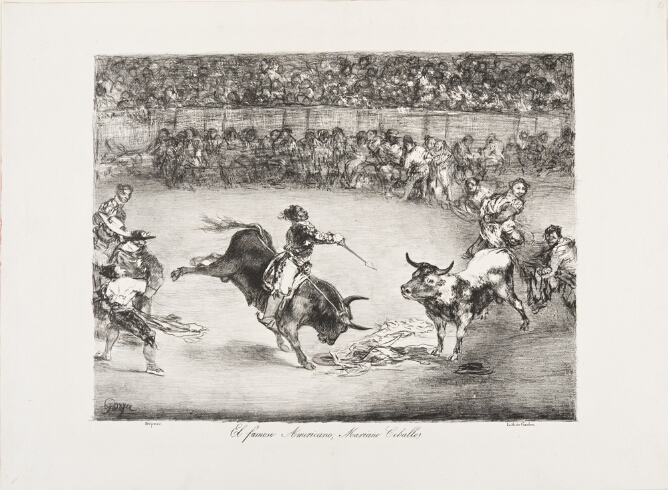 A black and white print of a man riding a bucking horse and aiming a spear at another bull, with crowds watching from inside and outside the arena