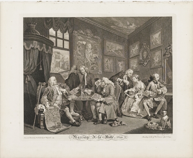 A black and white print of men sitting around a table in a lavish room. One points to an illustration of a tree growing out of a figure. To the viewer's right, a man and woman are sitting facing away from each other