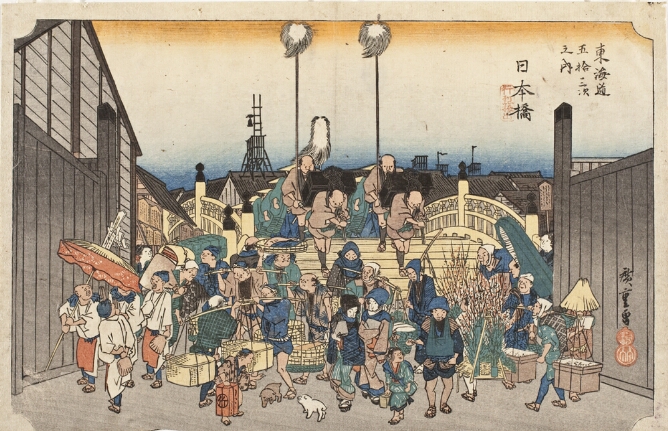 A color print of figures carrying luggage on their backs crossing a bridge towards the viewer. In the foreground, a crowd of other figures stand, some carrying sticks on their shoulders with hanging baskets