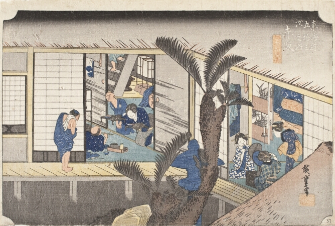 A color print of an inn courtyard with open sliding doors revealing one room of men relaxing, eating and being served by a woman, and another room with a group of women