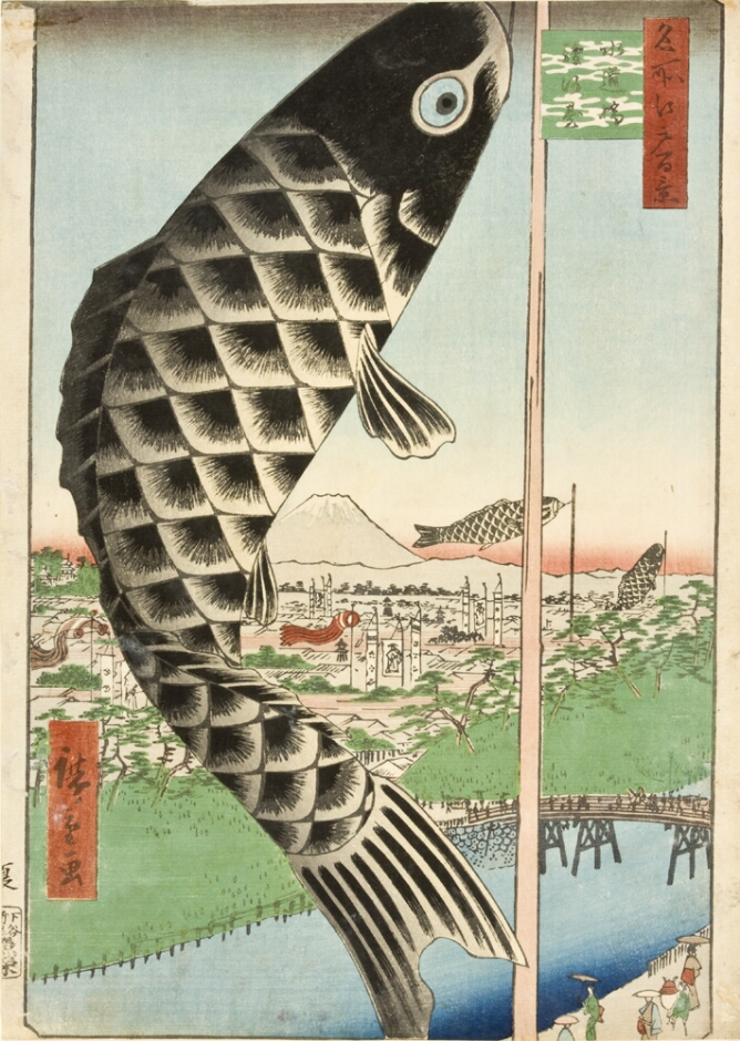 A color print showing the high vantage point of a large black and white carp banner on a pole with two others flying above a river and a bridge, with a village and mountain in the background