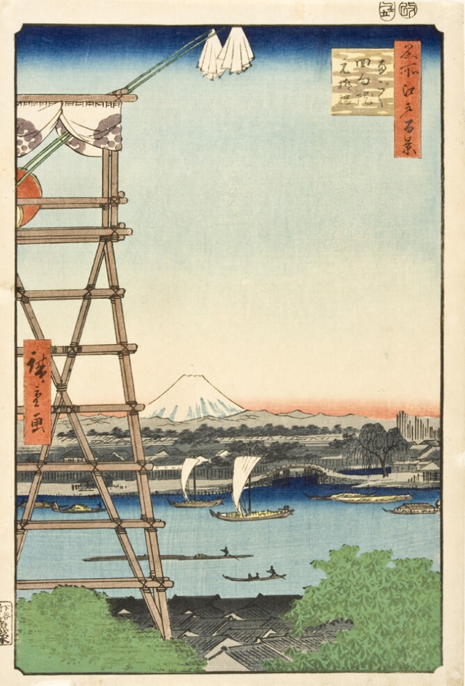 A color print showing a high vantage point of a drum-tower with two hanging white cloths to the viewer's left. Below, rooftops and sailing boats with a white mountain in the background