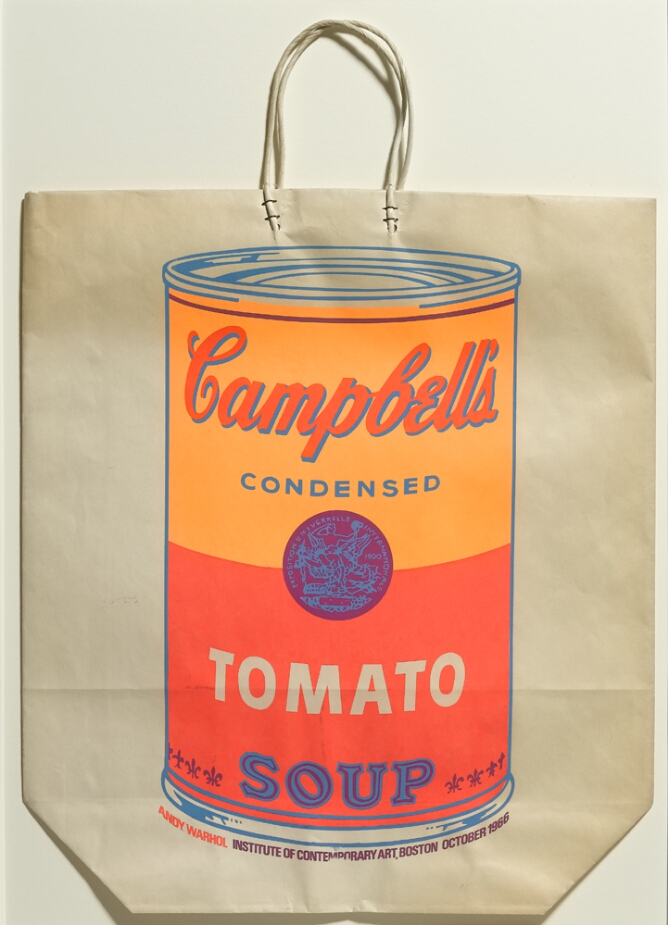 A large light orange and red Campbell's tomato soup can printed on a tan paper shopping bag