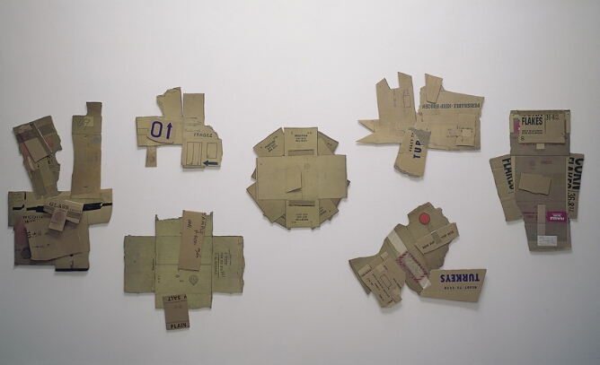Seven constructions of cardboard pieces with printed text collaged to create various abstract forms