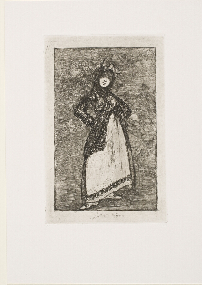 A black and white print of a woman with eyes in shadow from a headdress, standing with her hands at her hips against a dark background