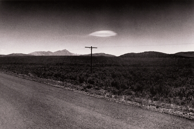 Untitled  (Looking Over Open Road between Phone Poles Toward Hills, Nevada)