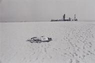 Untitled (Long Beach, Woman on Beach with Buildings in Background) - Hernandez, Anthony