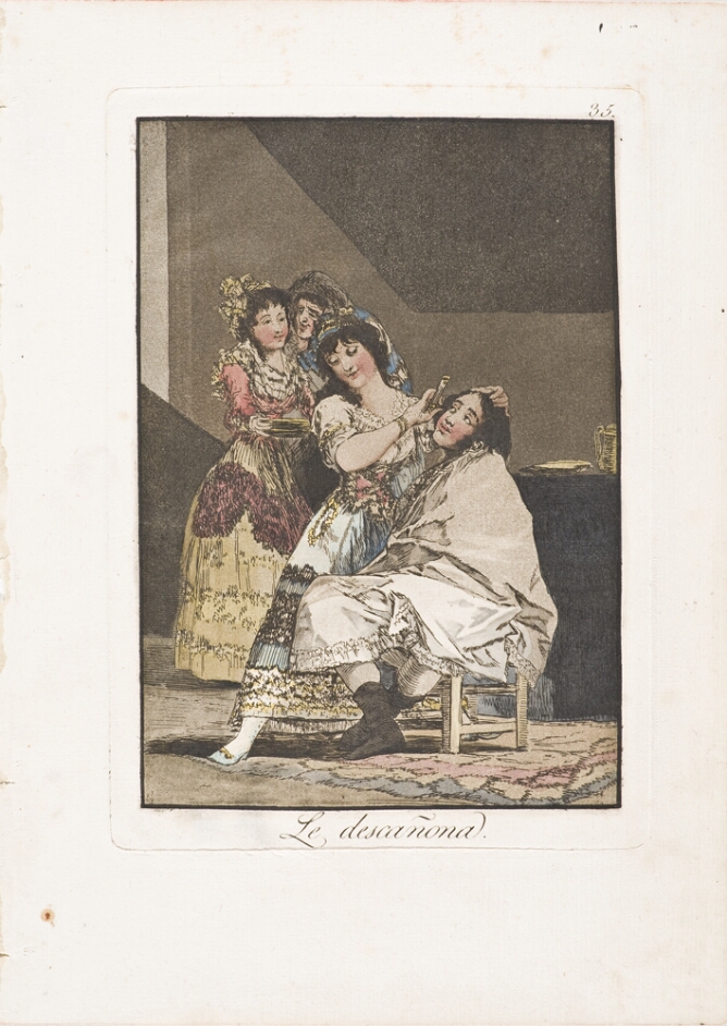 A color print of a seated man looking up at a woman shaving him, with two other women standing behind her