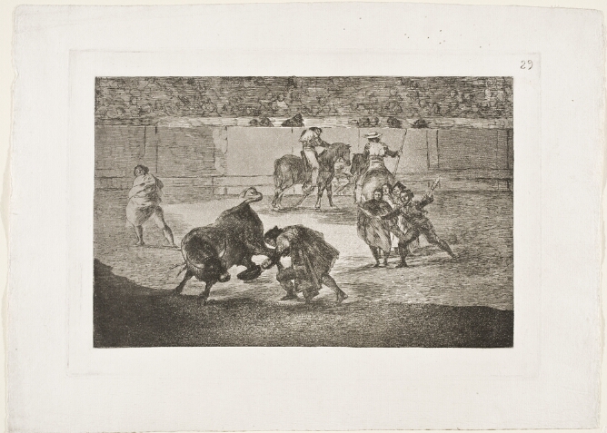 A black and white print of a standing man holding out his hat towards a turning bull in an arena, with onlookers and figures on horseback, and a faint crowd in the background