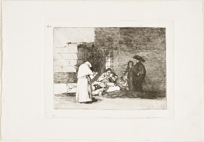 A black and white print of a standing figure offering a bowl to figures sitting and lying on the ground by a building, as a standing couple looks on