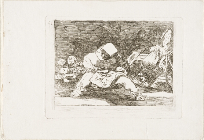A black and white print of a hooded figure sitting with legs apart and holding a spoon. Behind, a pile of masks, other miscellaneous objects and faintly visible figures