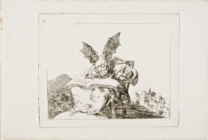 A black and white print of a figure with bat-wing ears sitting in a chair and writing in a book, with other figures below