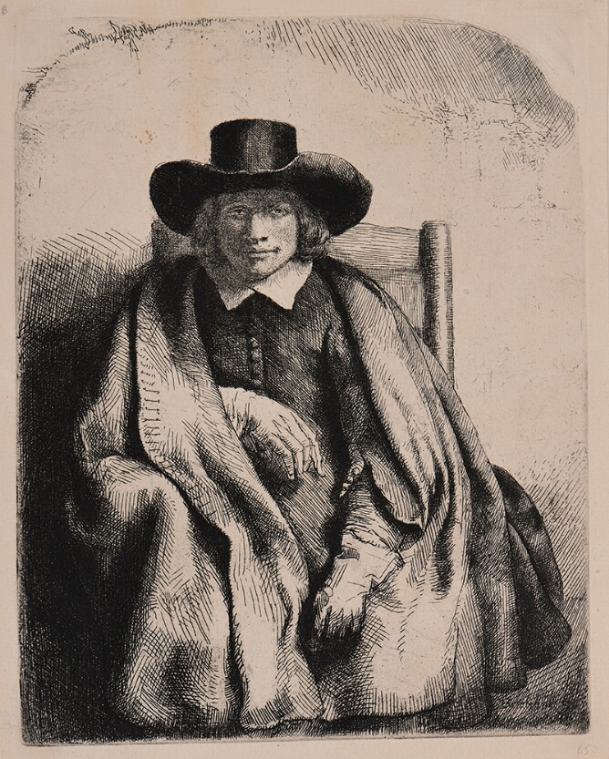 A black and white portrait of a man sitting in a chair wearing a broad-brimmed hat, cloak and gloves, shown from the knees up