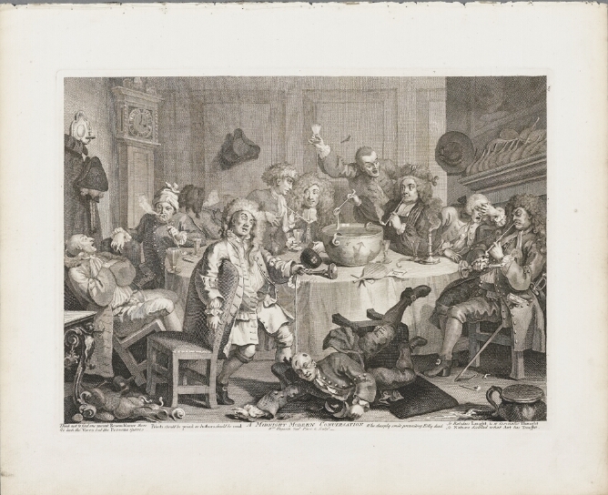 A black and white print of men in a room drinking and smoking around a table with a punch bowl. In the foreground, a man has fallen out of his chair