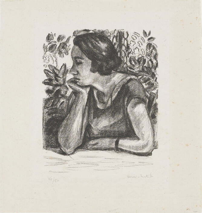 A black and white print of a woman in profile with closed eyes, her head resting on her hand, and her elbows on a table, set against a floral background