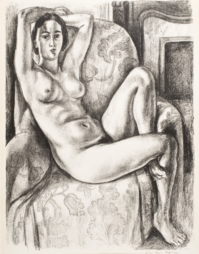A black and white print of a nude woman sitting on a sofa chair with one knee up and her arms behind her head