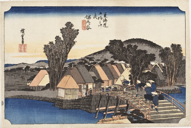 A color print of figures walking across a bridge over a river towards a village