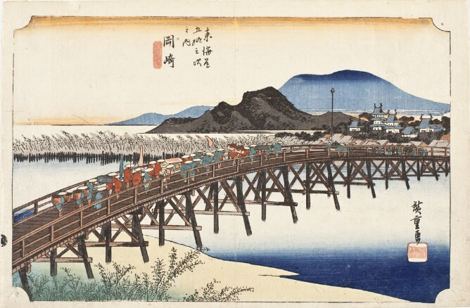 A color print of a procession of figures crossing a long bridge over a river towards a village, with mountains in the background
