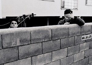 Untitled  (Two Teenagers Behind Concrete Wall)